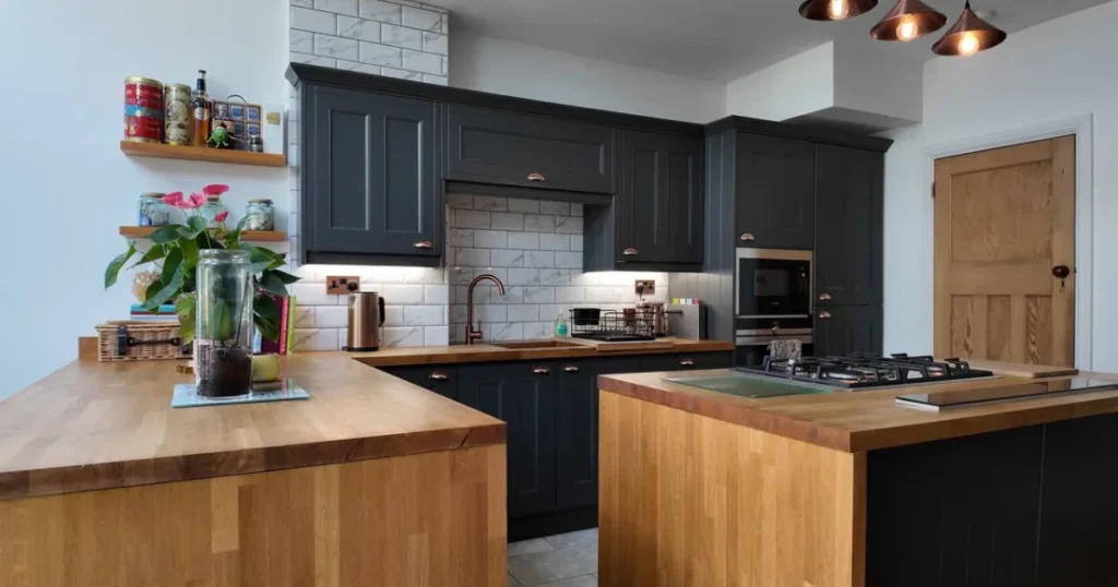 How to design a contemporary home with modern kitchen upgrades featuring dark shaker cabinets, natural wood countertops, subway tile backsplash, open-concept layout, and contemporary interior design elements. 