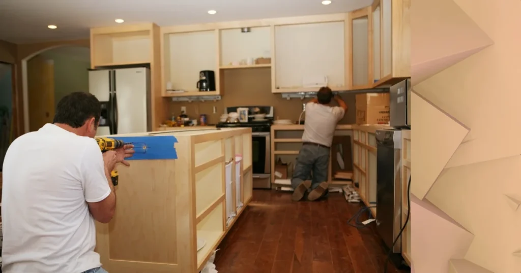 Local custom home remodelers are installing kitchen cabinetry during a custom home renovation project in Lake Zurich, creating a functional and modern cooking space.