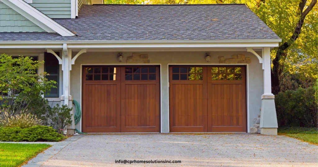 Traditional suburban home with a double garage and wooden garage doors, representing a property suitable for garage conversion services that can increase usable space and home value. 