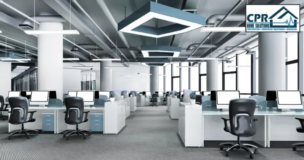 Modern office space featuring cubicles, ergonomically designed office chair and lights, indicating the output delivered by Office Renovation Contractor in commercial office renovation and interior fit out services. 